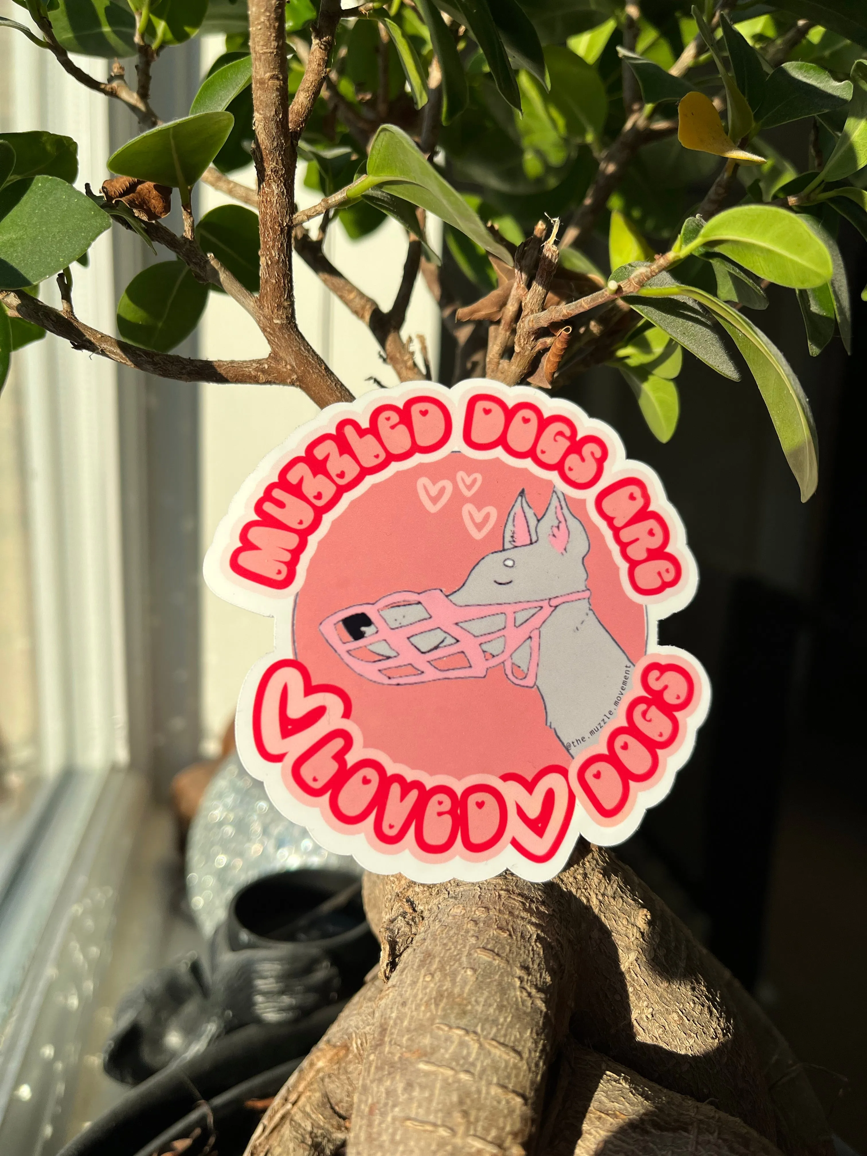 'Muzzled dogs are LOVED dogs' Sticker